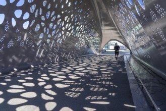 Light effects from the sun in the Parkbruk, a cycle and pedestrian bridge in the city centre of