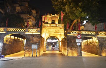 Illuminated old town gate at night, Hanoi, Vietnam, Asia