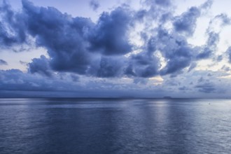 Sky with blue storm clouds over the sea in the marine reserve. Malaysia