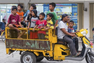 Children on a vehicle in an Indonesian village, village, child, boy, curious, curiosity, childhood,