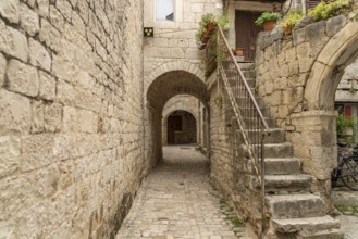 Narrow alley in the old town centre of Trogir, Croatia, Europe