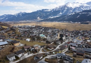 Drone shot, view of village with parish church, Piesendorf, Pinzgau, Salzburg province, Austria,