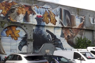 A mural showing birds and a squirrel in an autumn and winter landscape, Mural Trail, Glasgow,