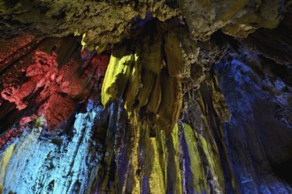 Stalactites illuminated by coloured LED light, stalactite cave, Höllgrotten, Baar, Canton Zug,