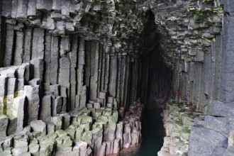 Dark cave with impressive basalt columns and deep water in a natural setting, Staffa, Inner