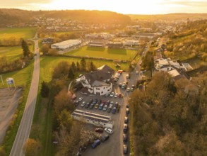 Urban landscape with an accentuated sunset over the fields and buildings, Europäischer Hof,