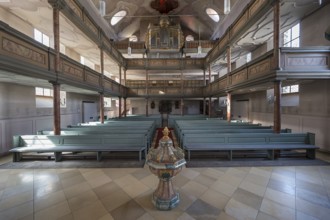 Interior of the organ loft, baptismal font in front1738 Inauguration of the baroqueised town church
