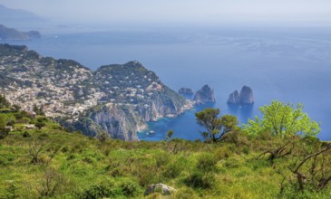 View from Monte Solaro 589m to the south coast with the Faraglioni rocks, the island's landmarks,