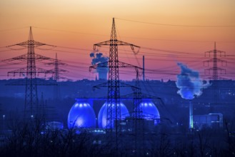 Digesters of the Emscher sewage treatment plant Bottrop, illuminated, high-voltage pylons, North