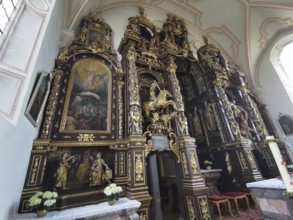Altar wall, votive pictures, votive tablets on the walls of the Chapel of Grace inside the church,