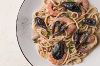 Spaghetti, pasta, with seafood, shrimp with mussels, in creamy garlic sauce, homemade, no people