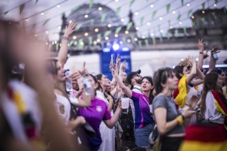 Scenes in the fan zone on Platz der Republik in front of the Reichstag building taken in Berlin, 29