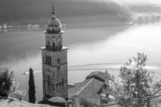 Church Tower Santa Maria del Sasso with Sunlight and Mountain on Lake Lugano in Morcote, Ticino in