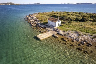 The island of Sveta Justina with the church of St Justina seen from the air, Pakostane, Croatia,