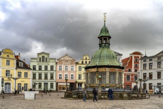 Market square with landmark Wasserkunst, Hanseatic city of Wismar, Mecklenburg-Western Pomerania,