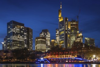 The Kansas City Chiefs' NFL boat is anchored on the River Main in front of Frankfurt's banking
