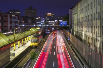 Essen, North Rhine-Westphalia, Germany, A40 motorway in the city centre at dusk. Underground line