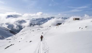Ski tourers in a wintry mountain landscape, Bündner Haute Route ski tour, Albula Alps, Rhaetian