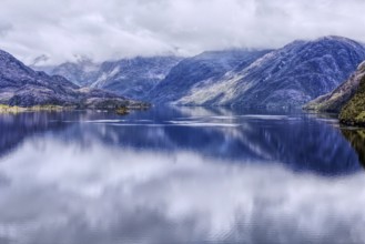 Fascinating landscape with mountains in the south of Chile, reflecting clouds on the surface of the