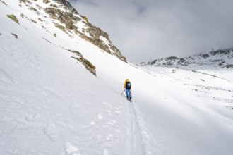 Ski tourers in a wintry mountain landscape, ascent to Piz Laviner from Chamanna Jenatsch, Grisons