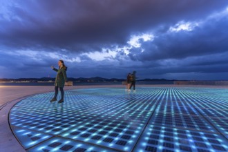 Artwork and solar installation Greeting to the sun at dusk, Zadar, Croatia, Europe