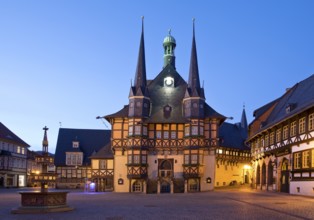 Market square with atmospherically illuminated town hall in the evening, Wernigerode, Harz,