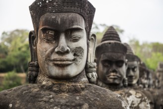Figures on the bridge to Angkor Thom, sunset, Angkor Wat, Angkor, UNESCO World Heritage Site, Siem