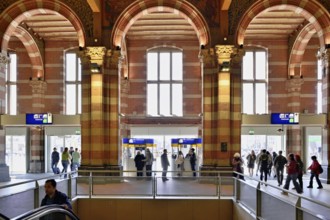 Interior view of Centraal Station, Central Station with flag, Amsterdam, Netherlands