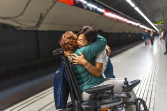 Disabled woman and friend reunited in the metro platform