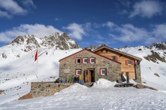 Chamanna d'Es-cha mountain hut in a wintry mountain landscape, Grisons Haute Route ski tour, Albula