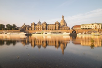 Silhouette of the Old Town with reflection in the Elbe in the morning, steamboats on the