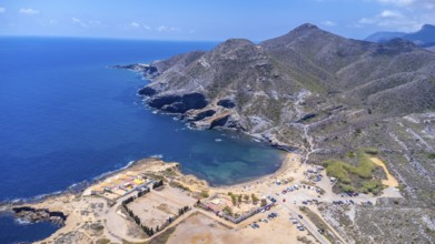 Aerial view of the stunning cala reona beach nestled between mountains in cabo de palos, spain,