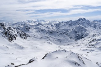 Mountain panorama with view of peaks of the Bernina group, view from Piz Grialetsch in winter,
