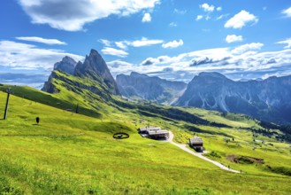 Stunning view of seceda peaks and green meadows in the italian dolomites on a sunny summer day