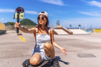 Chinese young female streamer vlogging online in a skate park