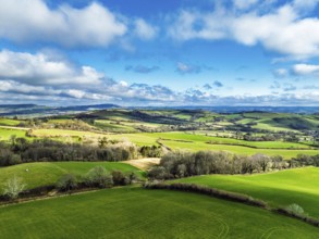 Farms over Morcombelake Village from a drone, Bridport, Dorset, England, United Kingdom, Europe
