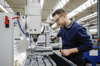 Remscheid, North Rhine-Westphalia, Germany - Trainees in metal professions, here at a machine tool,