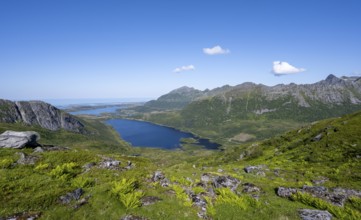 View of mountain landscape and valley with lakes, hiking trail to the summit of Rundfjellet,