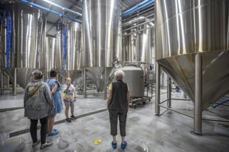 Covington, Louisiana - The Abita Brewing Company's craft beer brewery. A tour guide explains the