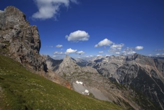 Fascinating view of high mountain peaks and clouds under a blue sky, Karwendel, Mittenwald,