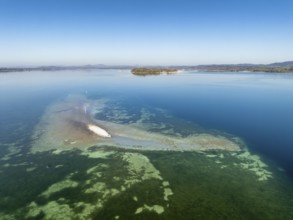 Aerial view of a shoal due to low water, drought, danger to shipping traffic, on the horizon the