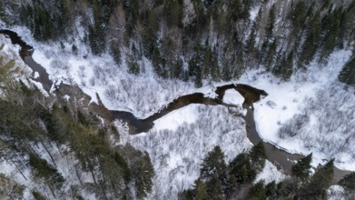 River in the boreal forest in winter. Region of La Mauricie. Province of Quebec. Canada
