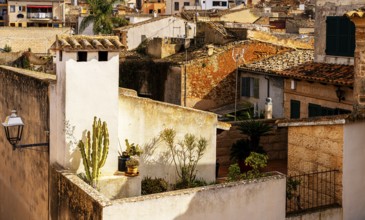 View of Mediterranean houses, roofs and courtyards from the town wall, Alcudia, Majorca, Spain,