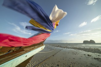 Longtail boat on the beach, at low tide, Koh Ngai Island, Andaman Sea, Satun Province, Southern