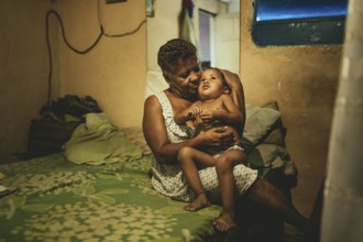 Lucilla Iriarte (68) with her grandson Alaín (2) in Petare, Caracas, Venezuela, South America