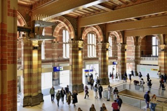 Interior view of Centraal Station, Central Station with flag, Amsterdam, Netherlands