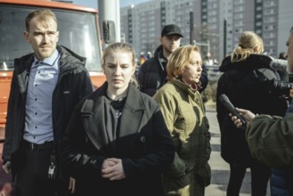 Bodyguards and Beatrix von Storch (in the background) at the final rally of Beatrix von Storch and