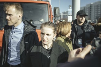Bodyguards and Beatrix von Storch (in the background) at the final rally of Beatrix von Storch and