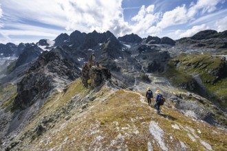 Two climbers on a mountain ridge, ascent to the summit of Mont de la Blana, view of rocky mountain