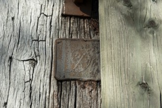 An old rusty hidden tin sign on a half-timbered barn, Wildeshauser Geest, Bassum, Diepholz, Lower